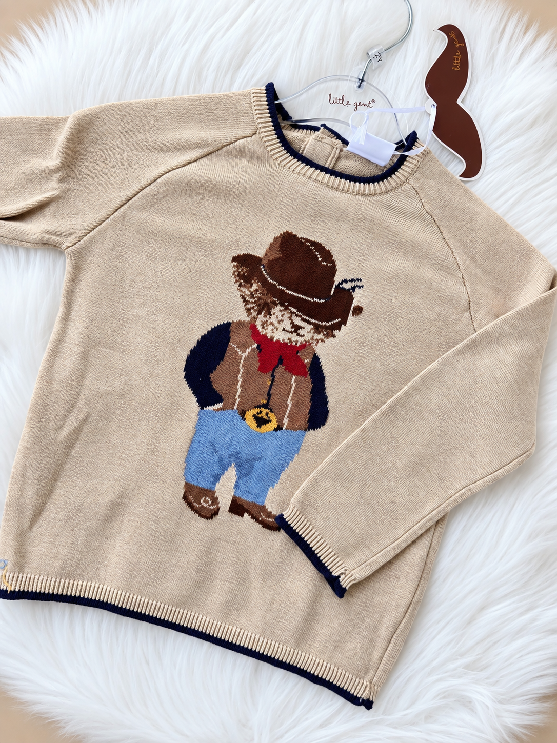 Beige knitted baby boys cowboy bear jumper with navy trim