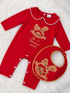 Personalised red Christmas rocking horse baby grow and matching bib with gold embroidery