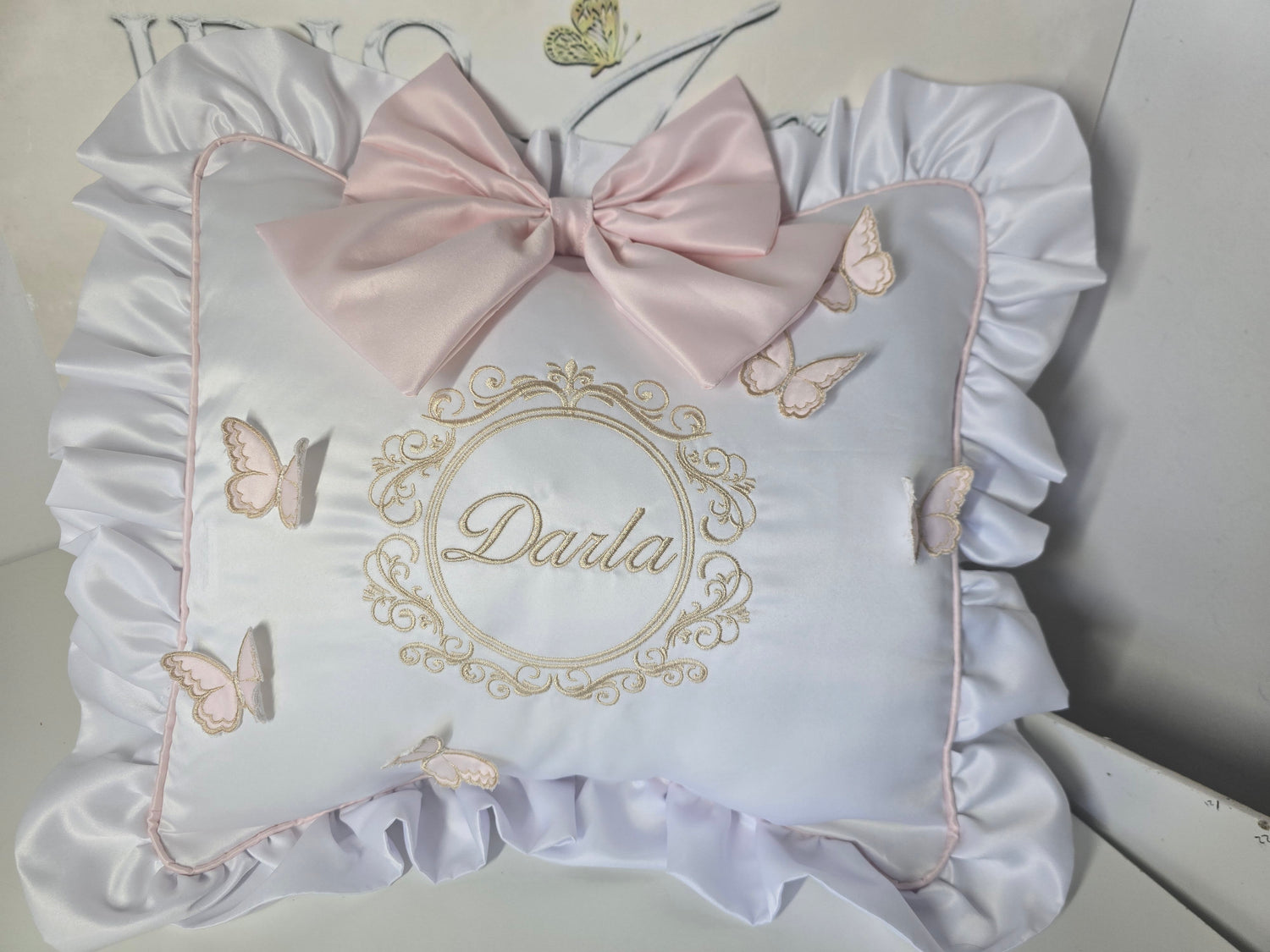 Cushion with piping, frill, bow and butterflies